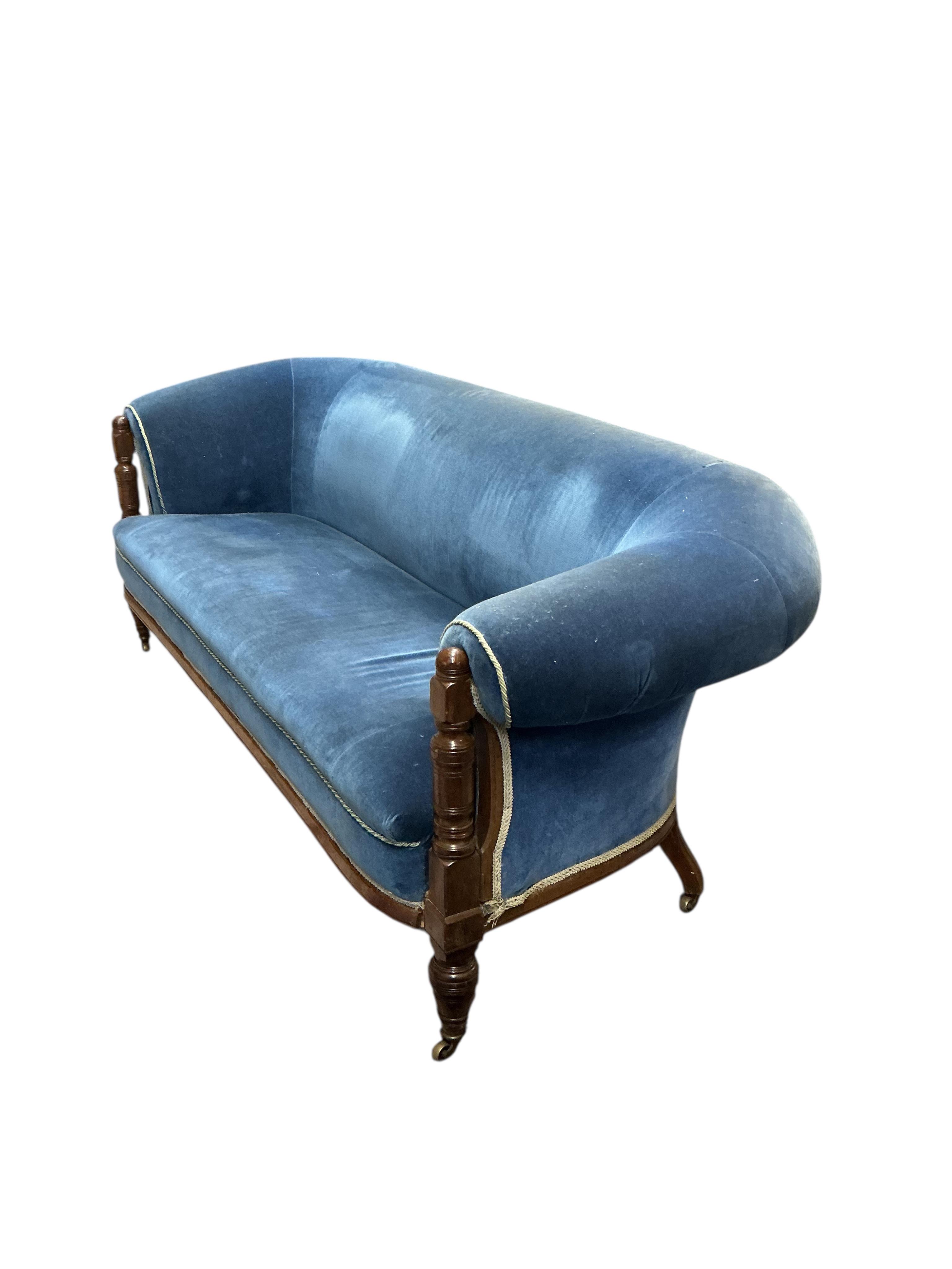 A late Victorian upholstered mahogany settee, width 200cm, depth 86cm, height 76cm.